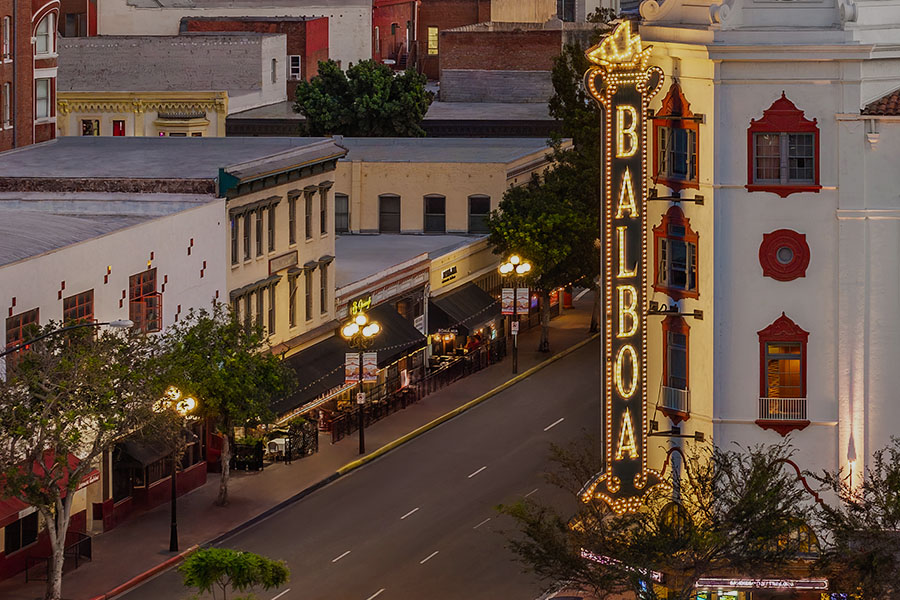 Balboa Theater aerial view of blade sign and restaurants along Fourth Avenue.