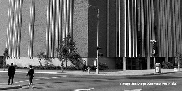 1965 exterior, street view of the Civic Theater with pedestrians crossing B Street.